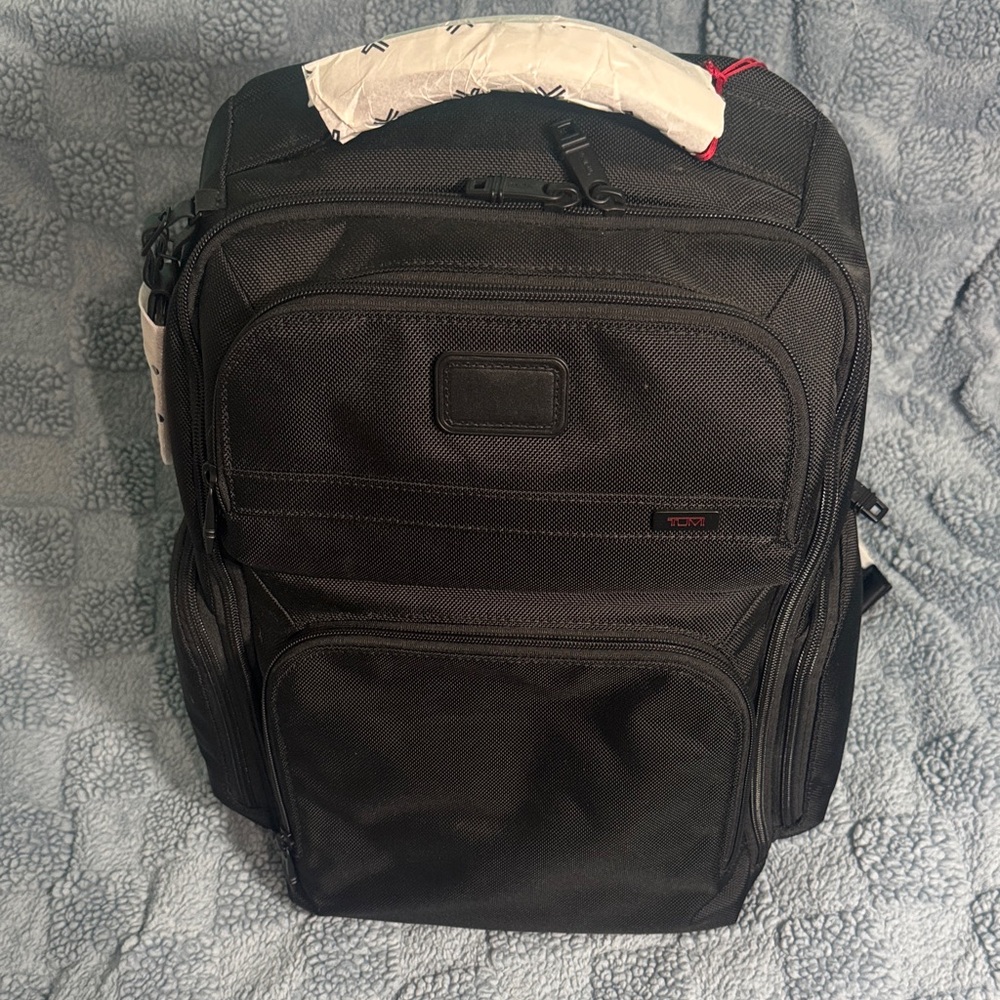 Tumi Black Travel Backpack with Multiple Compartments